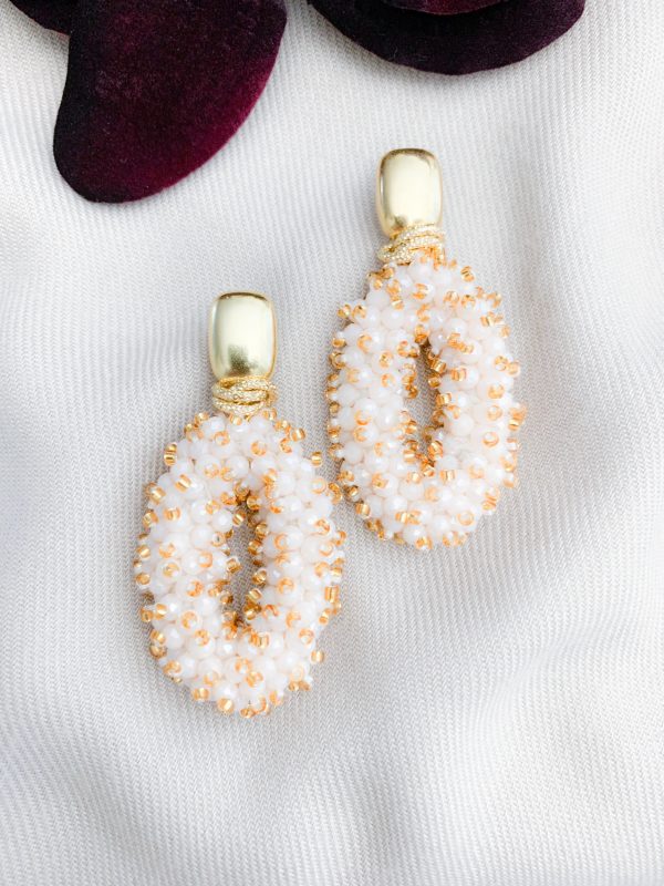 Ohrringe mit ovalen Kristallen in Cremegold